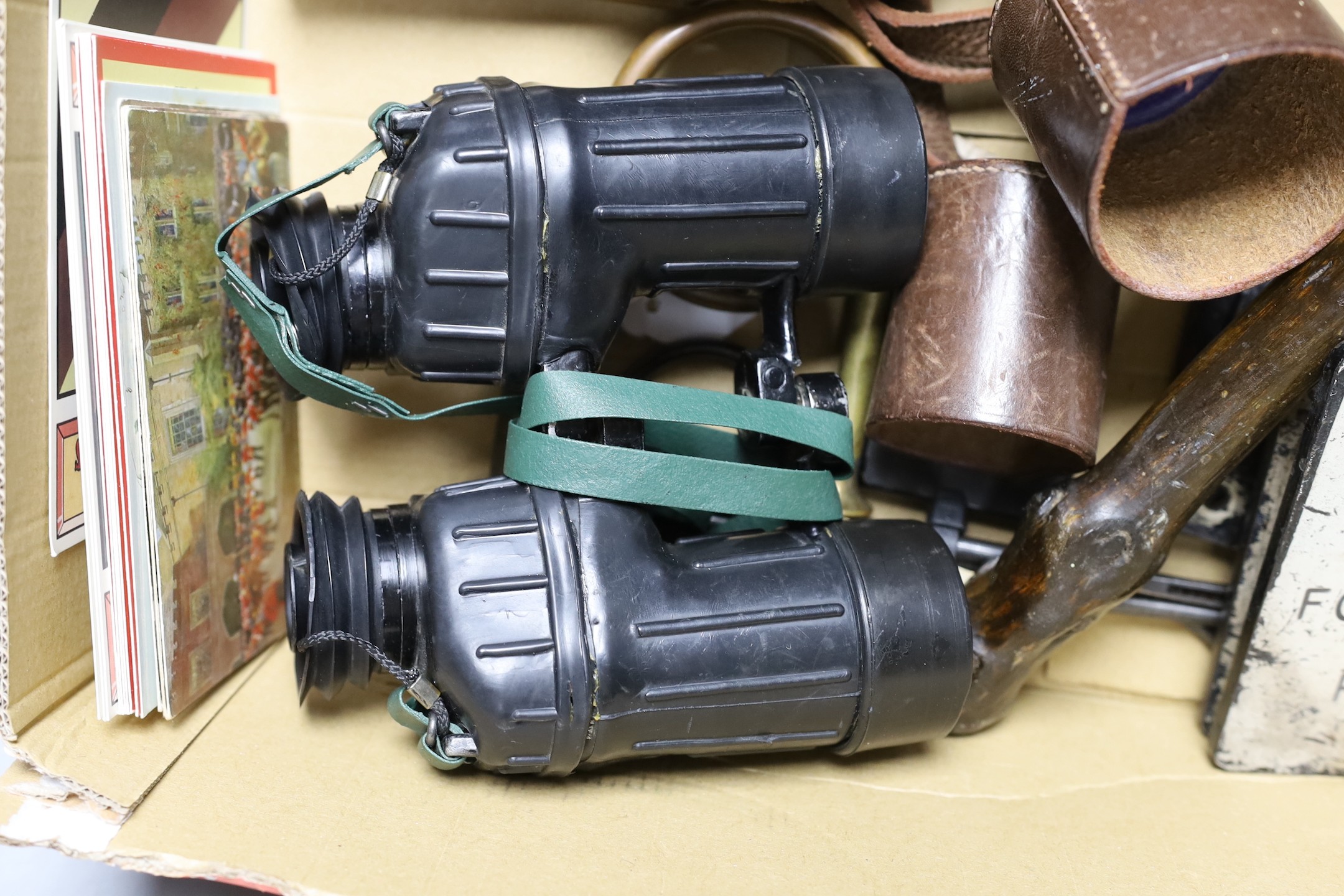 A group of mixed collectibles, including SAS binoculars.